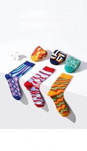 Detailed view of mid-calf cotton socks with colorful geometric patterns and tide style