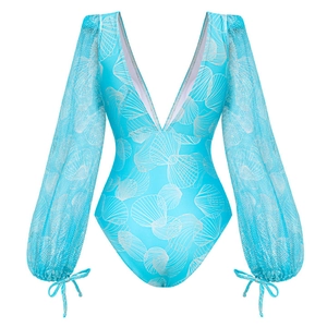 Detail of light blue swimsuit with white shell patterns and mesh sleeves with bows