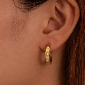 Minimalist 18K gold plated stainless steel hoop earring with three inlaid zircons on model
