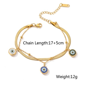 Detail of double-layer golden snake chain bracelet with evil eye charms and measurements