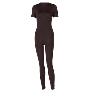 Detailed view of the brown ribbed knit short sleeve jumpsuit showing texture and zip design