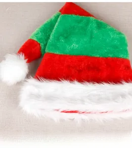 Detail of red and green striped Christmas elf hat with white plush ball and trim