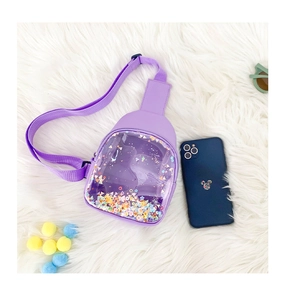 Detail of purple transparent PVC crossbody bag for kids with colorful sequins and stars