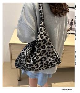Detail of knitted leopard print tote bag showing soft texture and large capacity