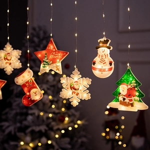 Hanging warm white LED Christmas window lights with stars, snowmen and festive trees