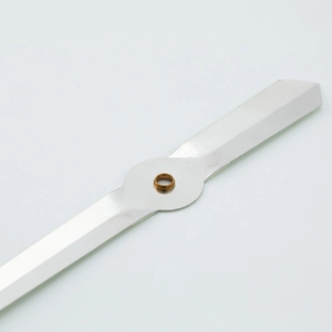 Luminous silver aluminum quartz clock needles with brass center hole on white backdrop