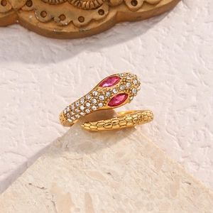 Snake ring in 18K gold plated stainless steel with sparkling crystals and red gemstone eyes