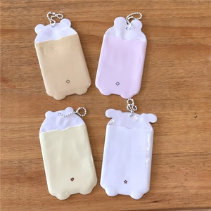 Cute macaron animal ear photocard holders with bead chains on wooden background
