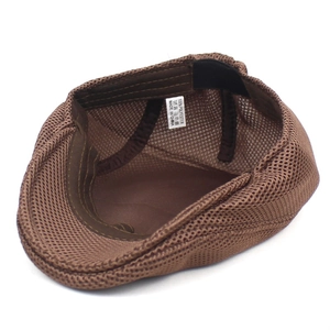 Detail view of the breathable polyester mesh lining and stitching of the brown beret hat