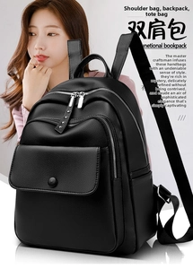 Detailed view of black litchi grain leather backpack with three zipper compartments