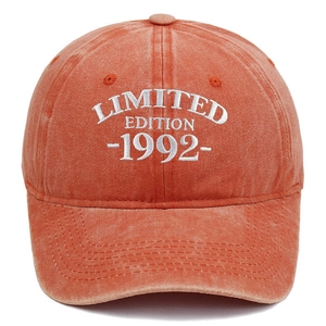 Detail of white 1992 Limited Edition embroidery on vintage washed orange baseball cap