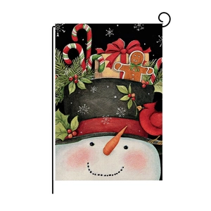 Detailed close-up of Christmas snowman garden flag featuring gifts and red cardinal bird