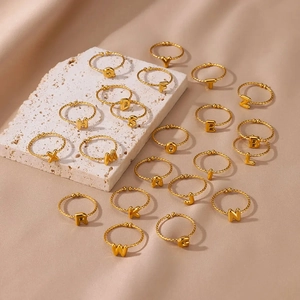 18k gold plated stainless steel initial rings with twisted rope band and open design