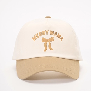 Two-tone cotton baseball cap featuring Merry Mama embroidery and gold bow detail