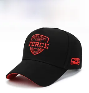 Detail of red shield embroidery and Force text on the side of a black cotton baseball cap