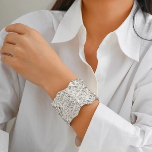 Irregular textured silver punk cuff bracelet with a modern molten lava design for women