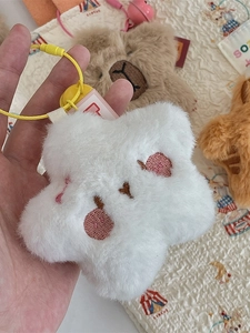 Cute white star-shaped plush keychain with embroidered face and yellow lanyard for bags