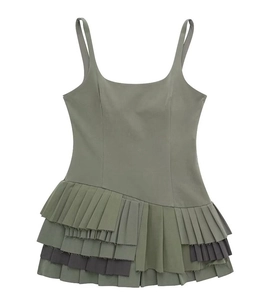 Detail of olive green camisole dress with asymmetric pleated layered hemline