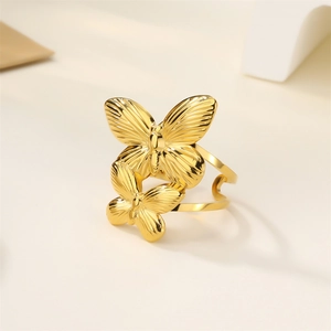 Detailed close-up of a 18k gold butterfly ring with elegant dual butterfly motif