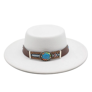 Detail of white wide-brim felt hat with bohemian braided band and turquoise stone