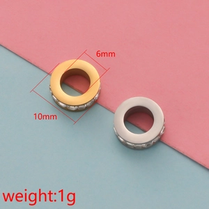 Macro view of 6mm and 10mm cylindrical hollow spacer beads in gold and silver finish