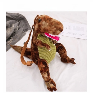 Detail of cute plush dinosaur backpack featuring brown spots and green corduroy belly
