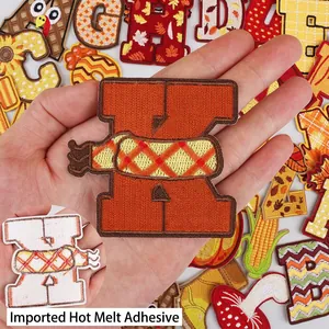 Alphabet embroidery patches with fall harvest themes featuring iron-on adhesive backing