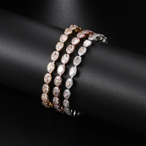 Detailed view of three adjustable tennis bracelets in gold, rose gold and silver finish