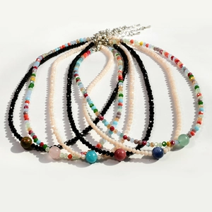 Detailed macro view of colorful agate and crystal bead necklaces with lobster clasp