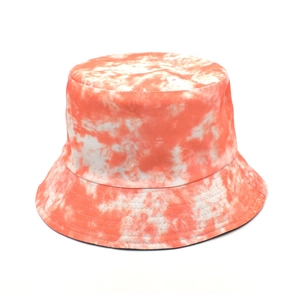 Detailed top view of orange and white tie-dye bucket hat showing cotton fabric texture