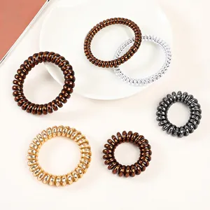 6-piece set of metallic spiral telephone wire hair ties in brown, gold, and silver colors