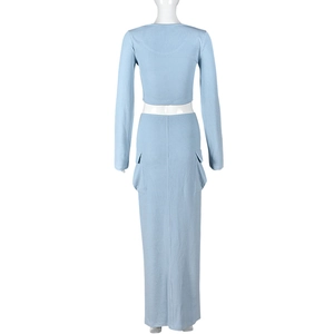 Rear view of light blue ribbed knit set with cropped top and cargo maxi skirt on mannequin