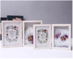 Detail of 5x7 inch foldable wooden shadow box with dried flower display and photo slot