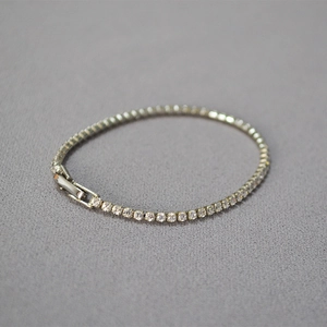Elegant silver tennis bracelet featuring sparkling cubic zirconia with a secure folding clasp