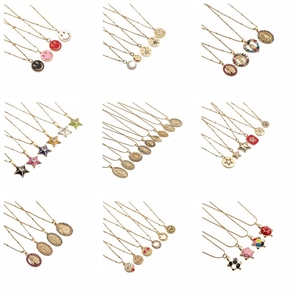 Collage of copper gold necklaces featuring colorful enamel and zircon religious pendants