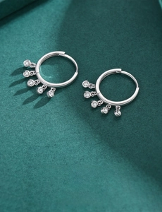 Close-up of S925 sterling silver hoop earrings with five sparkling zircon pendants