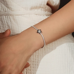 Elegant S925 sterling silver bracelet with a black enamel star pendant and tiny diamonds