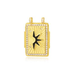 Detailed view of a gold square tarot pendant with black star and sparkling crystals