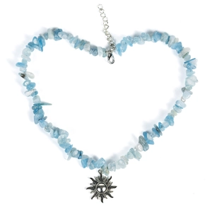 Irregular blue natural stone beaded necklace with a silver sun pendant on white background