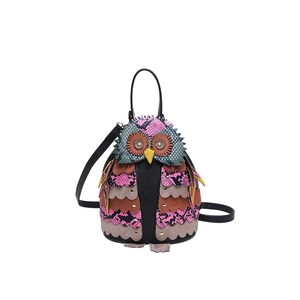 Creative owl-shaped PU leather bag with colorful snake pattern and gold hardware details