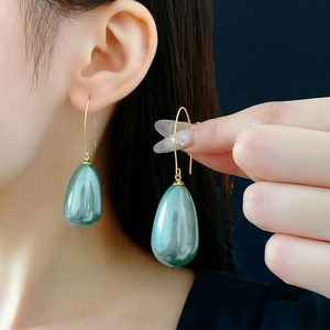 French vintage teardrop pearl earrings with green luster and gold hooks for women