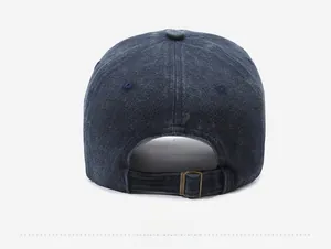 Detail view of the vintage washed baseball cap's back with Orlando embroidery and buckle