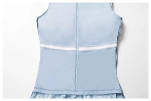 Detail of light blue dress featuring back invisible zipper and white ribbon waistband