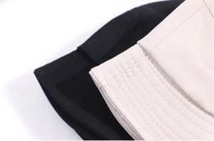 Cotton pyramid bucket hat for outdoor hiking in black and beige with durable stitching