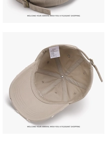 Detailed view of 100% cotton baseball cap with vintage worn edges and metal buckle