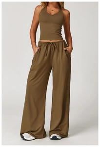 Detail view of olive green halter neck yoga top and drawstring wide leg sports pants
