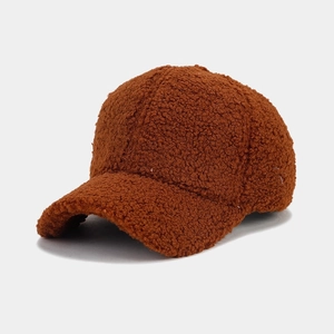 Detailed texture of thick brown fleece fabric on a warm winter baseball cap