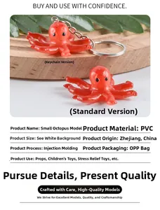 Detailed close-up of a red PVC realistic mini octopus model keychain on a wooden plate
