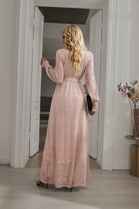 Detail of a pink sequin long-sleeved dress with a back tie-up waist design