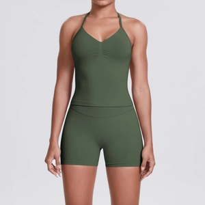 Detailed texture of seamless olive green knit yoga set with high waist compression shorts